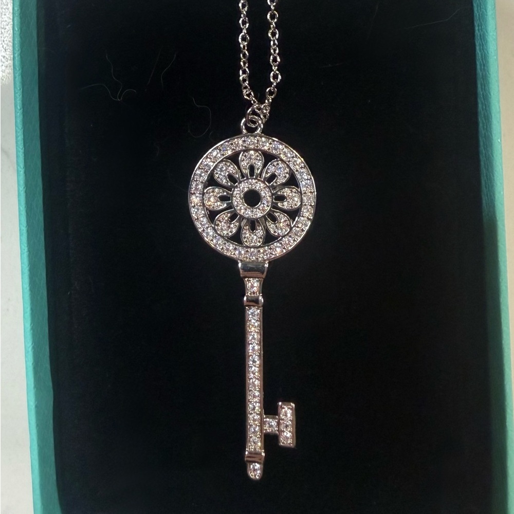 Tiffany & Co. Silver Key Pendant Necklace with Crystal Floral Wheel